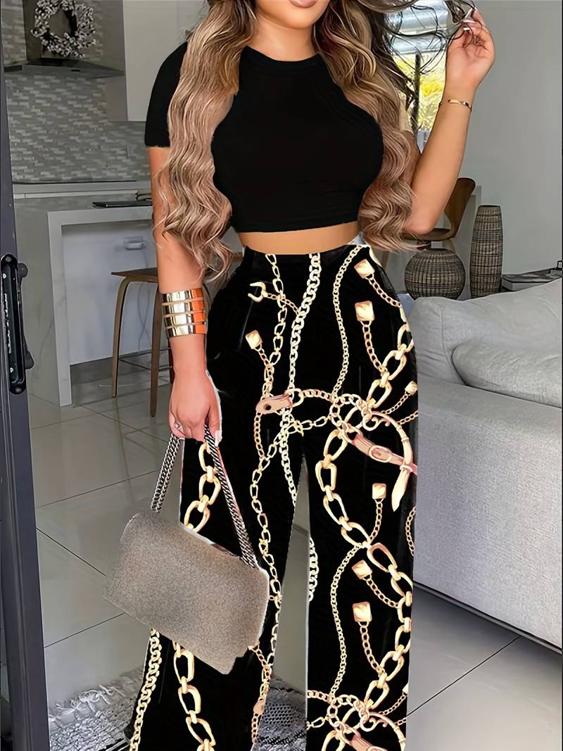 Rosie | Tweedelige set met top en gebloemde broek-Sets & Pakken-Calora-Zwart-XS-Calora