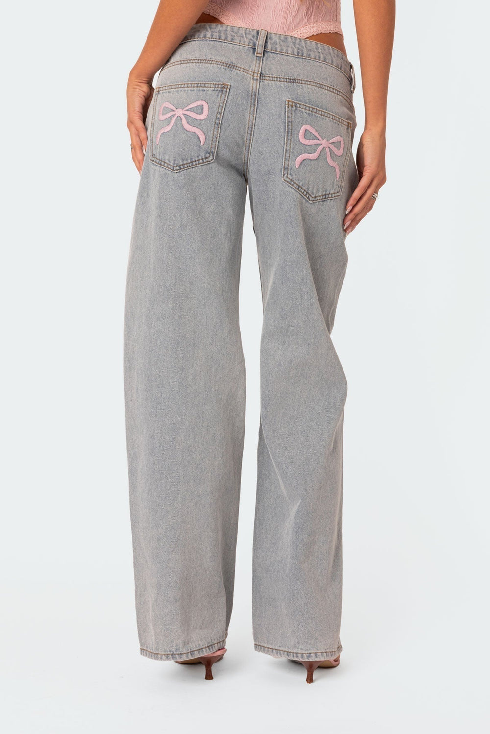 CALORA_ Speelse Bow Tie Jeans met Boordetail en Elegante Achterzak