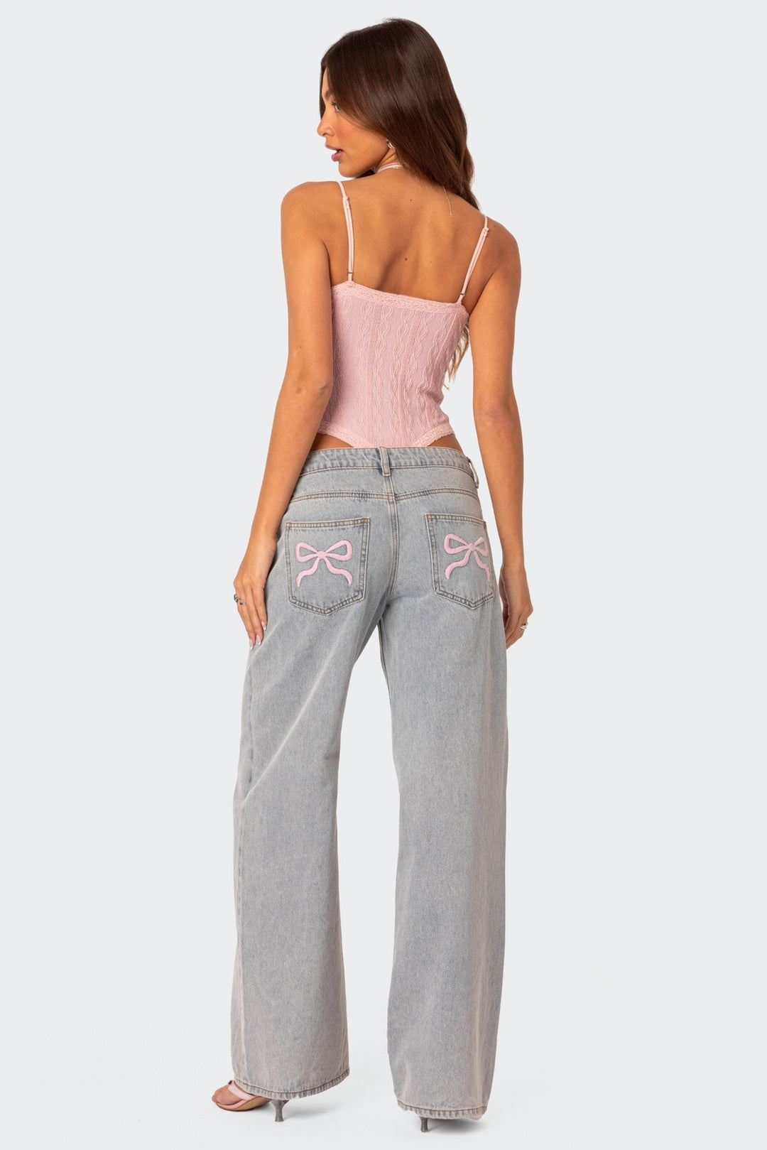 CALORA_ Speelse Bow Tie Jeans met Boordetail en Elegante Achterzak